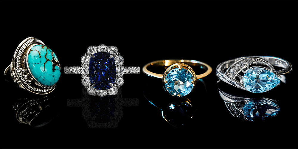 Restored December Birthstone Rings Turquoise Tanzanite Blue Zircon and Blue Topaz Gemstones Displayed on Black Background