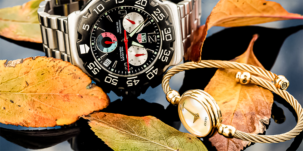 Men and Women Watches Displayed with Leaves in Autumn Set