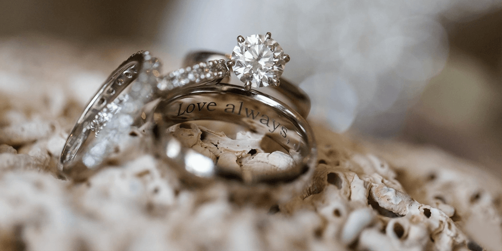Diamond engagement ring with the engraving "Love always" on inside of wedding band