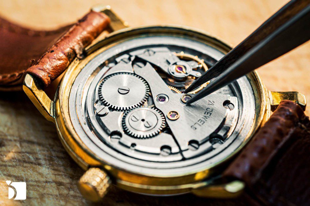 Image showing a vintage manual wind-up mechanical watch being worked on