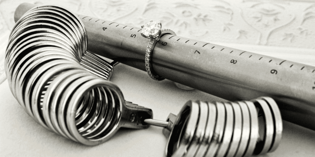 Diamond engagement ring around ring sizer