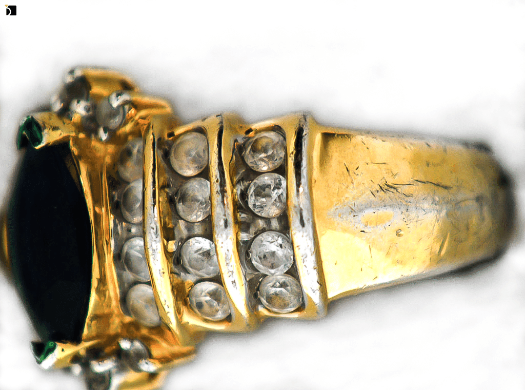 Image Showcasing Side View of a Gold Ring Before It Gets Refurbished and Reshapen