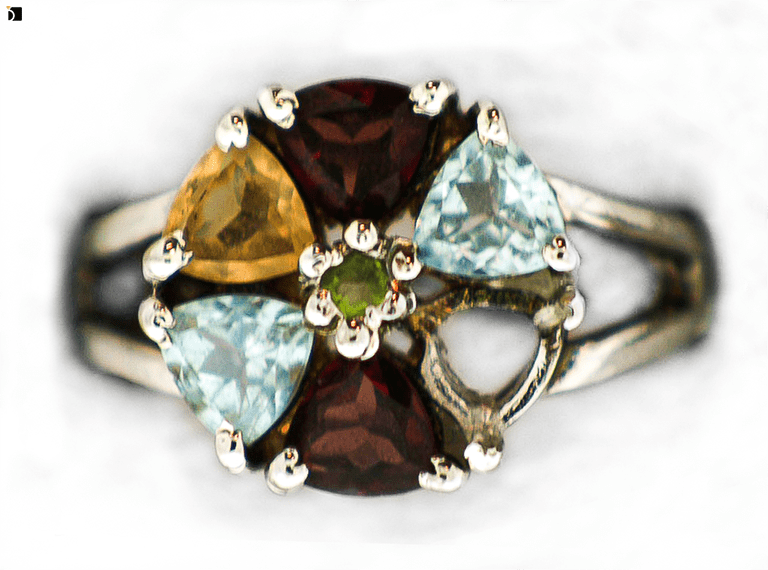Image Showcasing a Multi Gemstone Ring Before It Gets Refurbished and a Citrine Gemstone Replacement