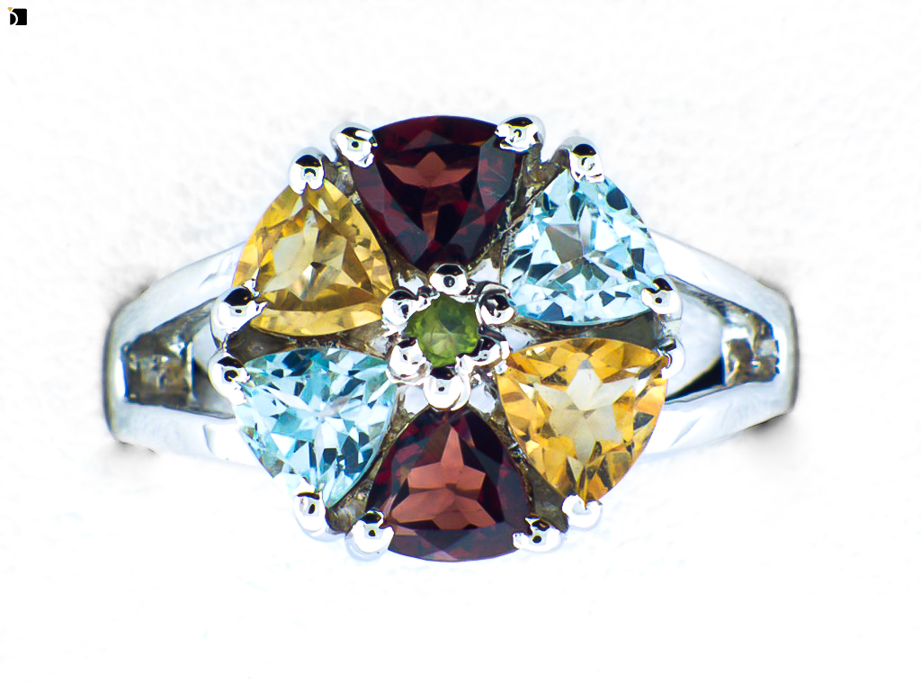 Image Showcasing a Multi Gemstone Ring After It Gets Refurbished and a Citrine Gemstone Replacement