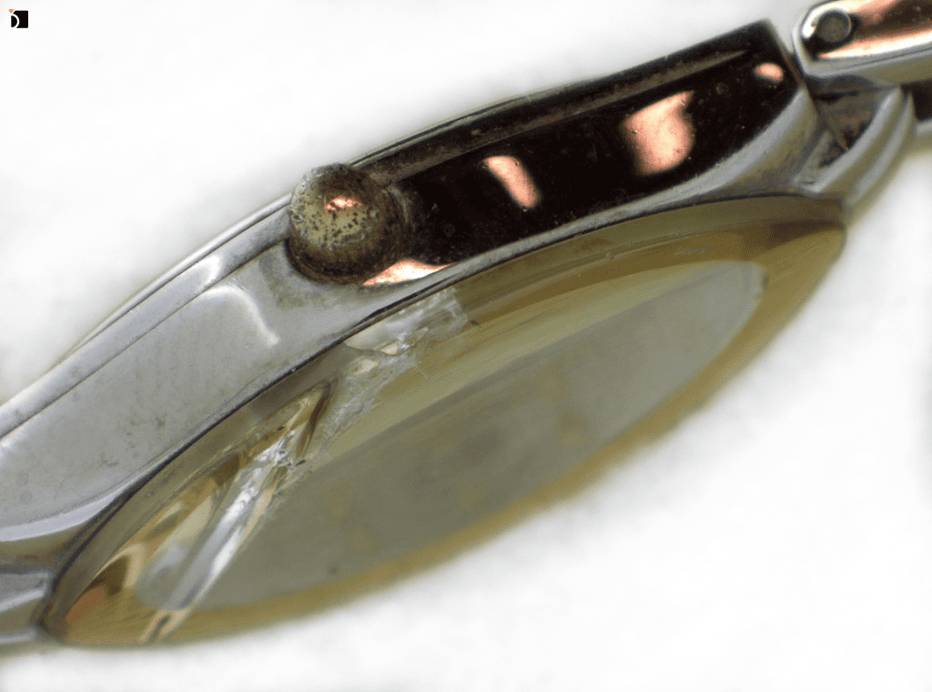 Image Showcasing Side View of an Armitron Timepiece Before It Gets Refurbished and a Watch Crystal Replacement