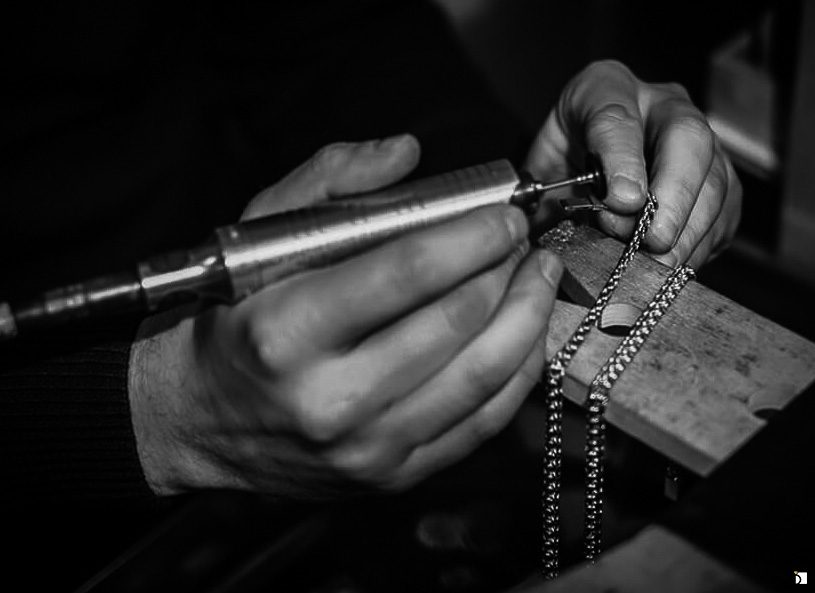 Image showcasing jeweler servicing a necklace chain through My Jewelry Repair premier necklace repair services