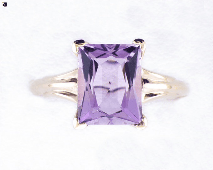 Image Showcasing After #2 Top View of a Gold Ring with Purple Gemstone Getting Extreme Transformation Through Premier Ring Repair Services and Gemstone Resetting by My Jewelry Repair Master Jewelers