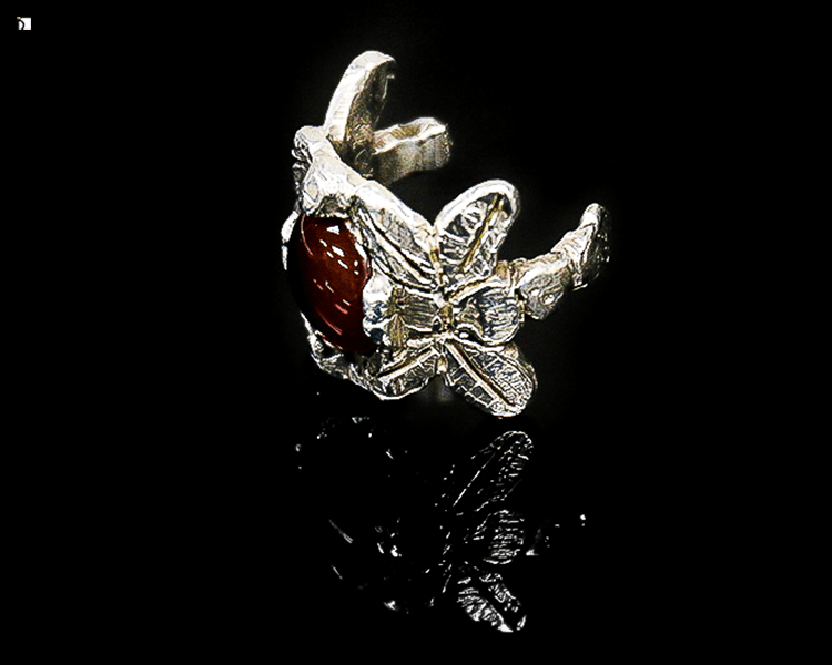 Before #110 Side View of Red Gemstone Silver Ring With Broken Shank Restored by Premier Ring Repair Services
