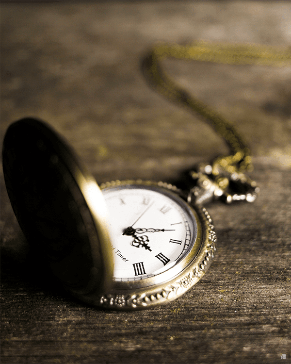 Restored Gold Vintage Pocket Watch Open and Laying on Wooden Table