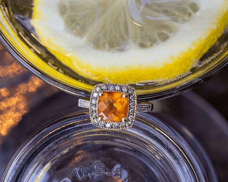 Restored Fine Jewelry Diamond Citrine Main Gemstone Ring Between Glasses of Lemon Water Feature