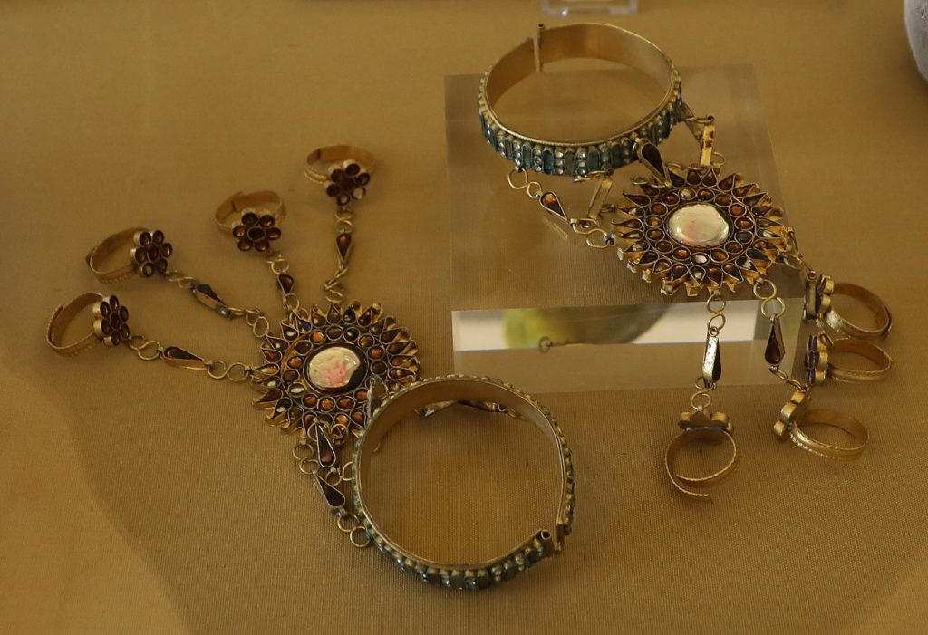 Image showcasing 1920's bracelets set with gemstones