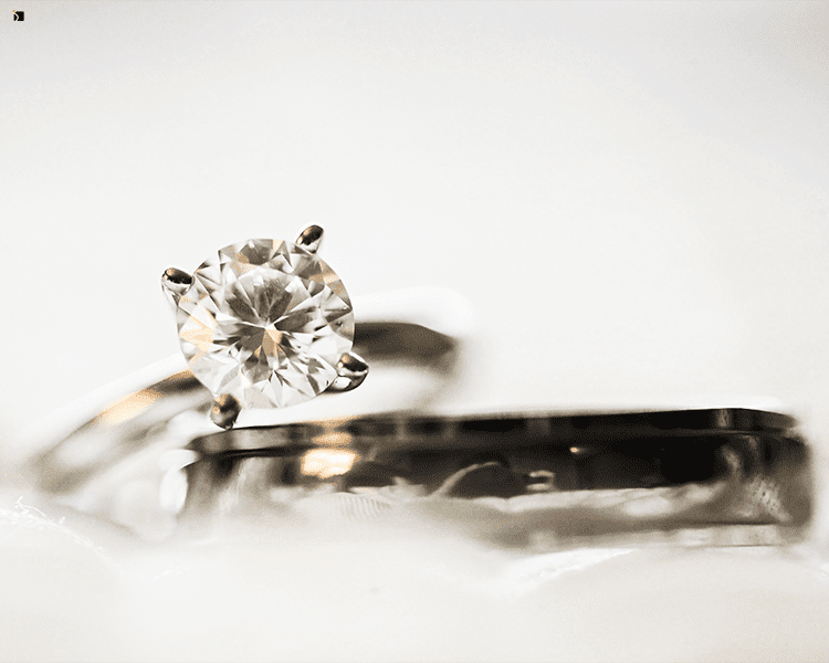 Restored Engagement Diamond Gemstone Ring and Wedding Band Fine Jewelry Set Displayed on White Background
