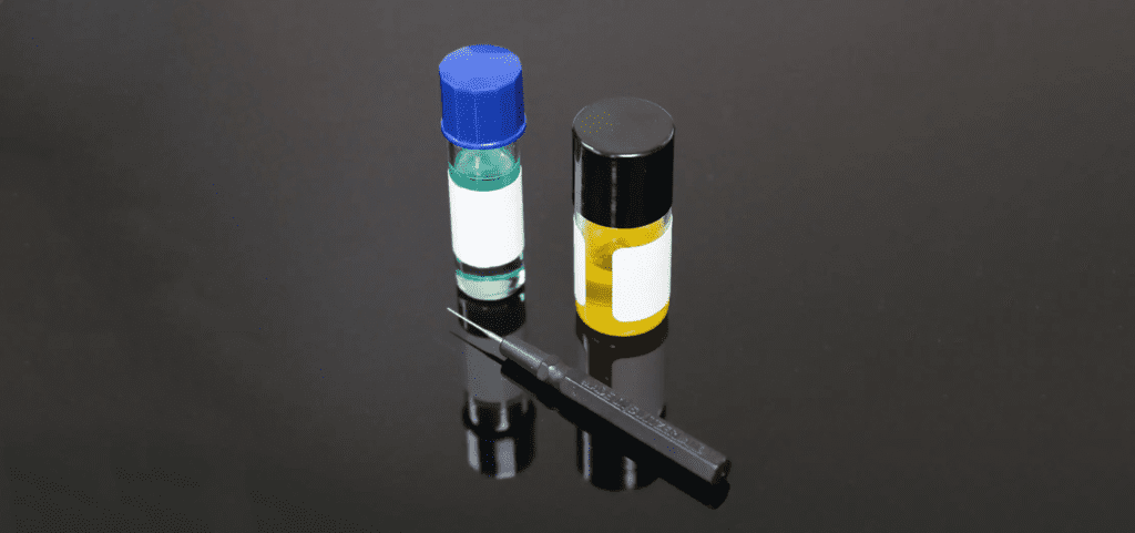 Image showing two different bottles of watch oil