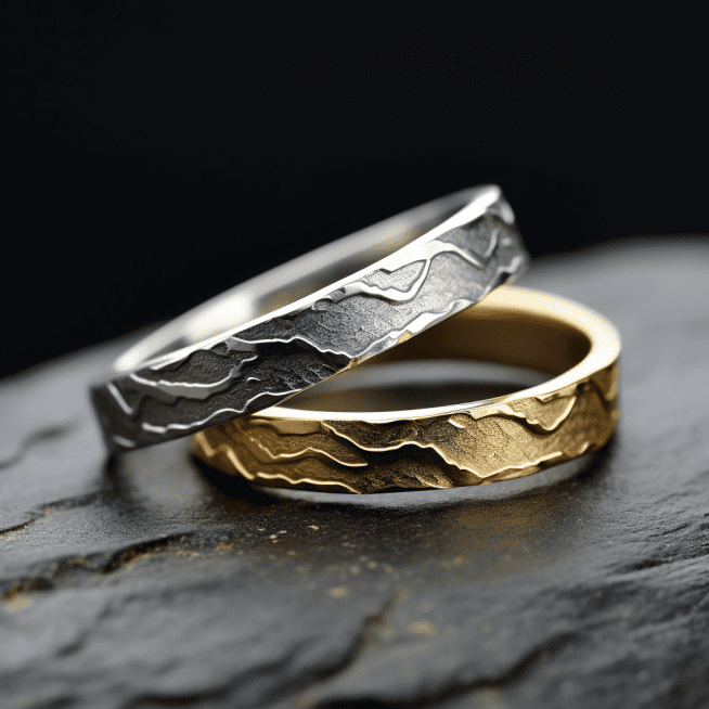 Photo of one silver wedding band and one gold wedding band.