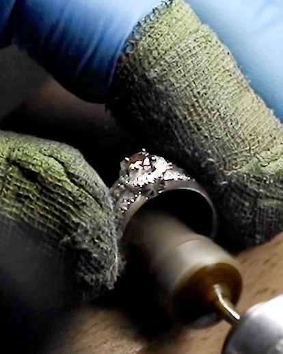 Photo showcasing jeweler at My Jewelry Repair resizing diamond ring