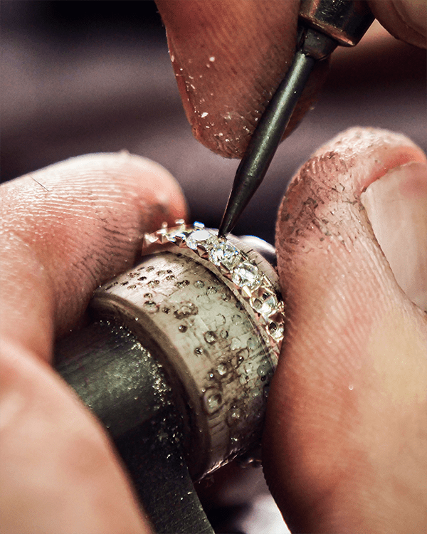 Close Up Master Jeweler Repairing Ring Prong Retipping Gemstone Setting Restoration Services