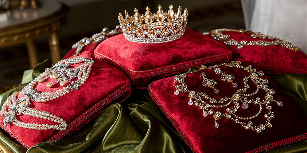 Close Up of Queen Charlotte Royal Jewels Necklaces and Crown Displayed in Palace