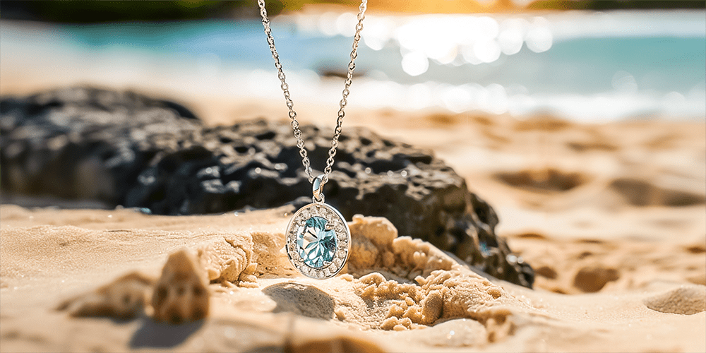 Restored Blue Gemstone Necklace Pendant Displayed over Beach Sand Summer Environment