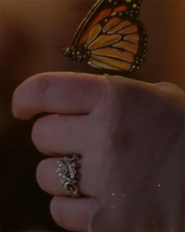 Close Up of Penelope Bridgerton's Hand with Wedding Band Holding Monarch Butterfly at Ball