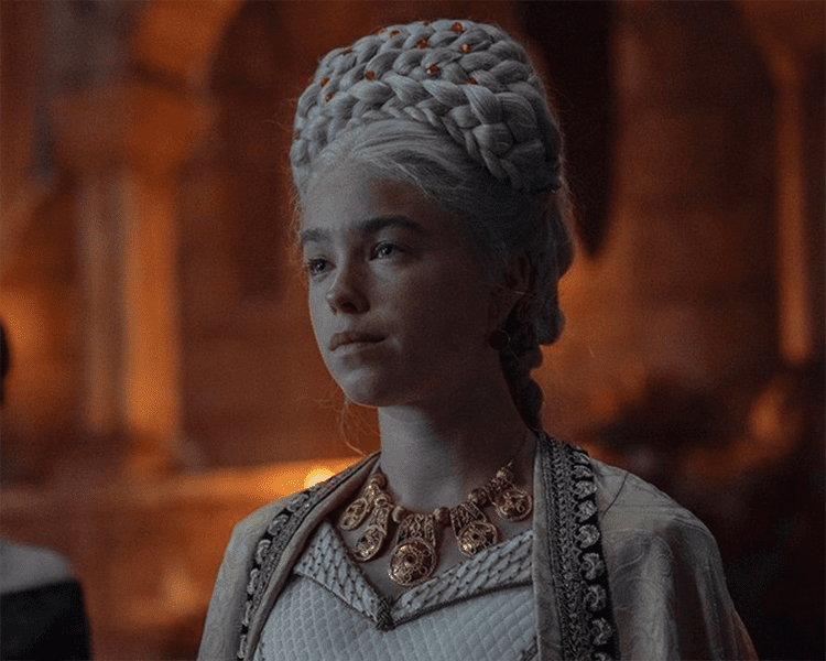 Young Rhaenyra Wearing Ornate Targaryen Jewelry and Red Gemstones in Hair