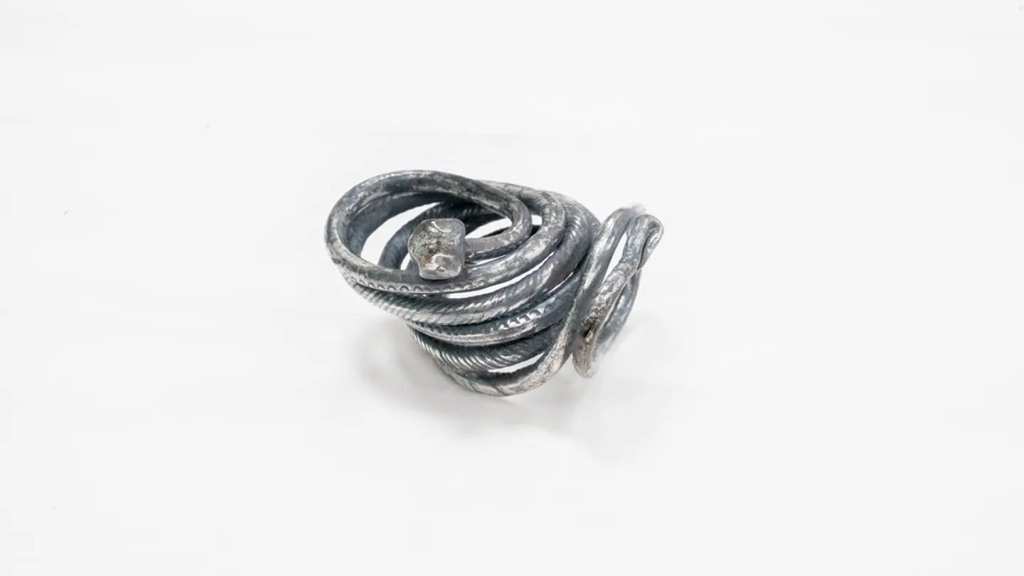 Image showcasing silver snake ring from the Viking Era around 800 A.D.