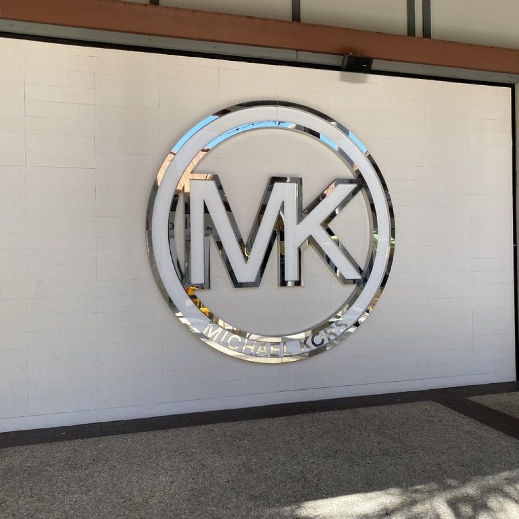 Image showcasing Michael Kors store logo 