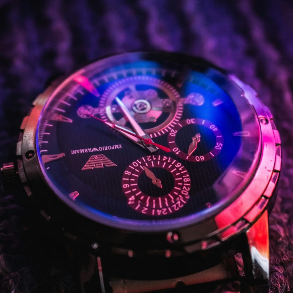 Image showing emporio armani watch in purple, pink, and blue lighting