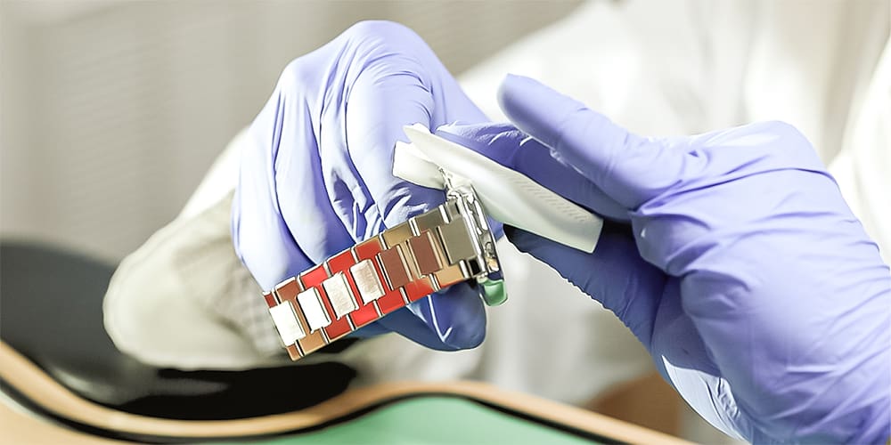 Certified Watchmaker Cleaning Watch Exterior with Cloth