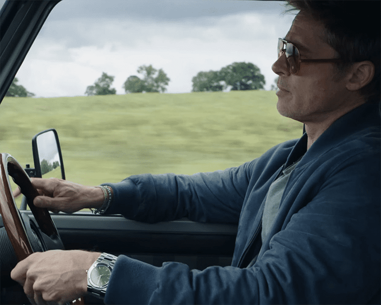 Still of Brad Pitt with Custom IWC Timepiece F1 The Movie via Revolution Watch