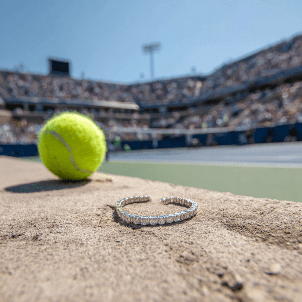 Image showcasing tennis bracelet and tennis ball on tennis court