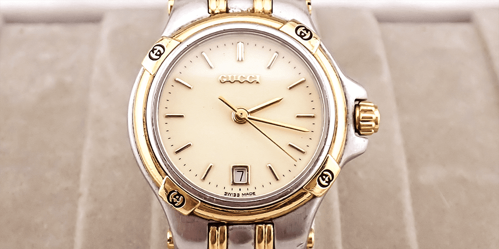 White and Gold Gucci Timepiece on Display Professional Watch Repair