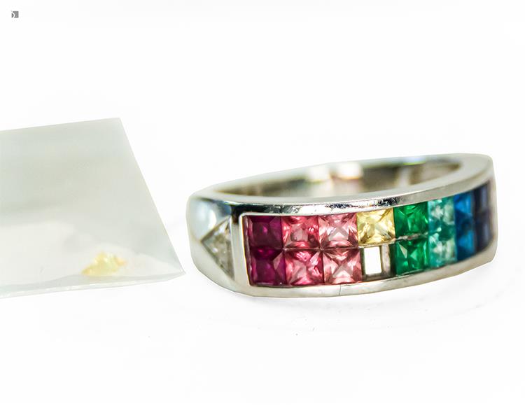 Before #182 A Loose Yellow Gemstone Next to Invisible Set Gemstone Ring Prior to Restoration