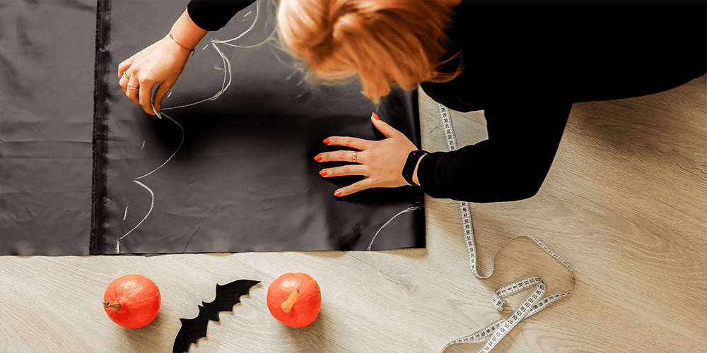 Woman Creating DIY Halloween Costume Incorporating Jewelry