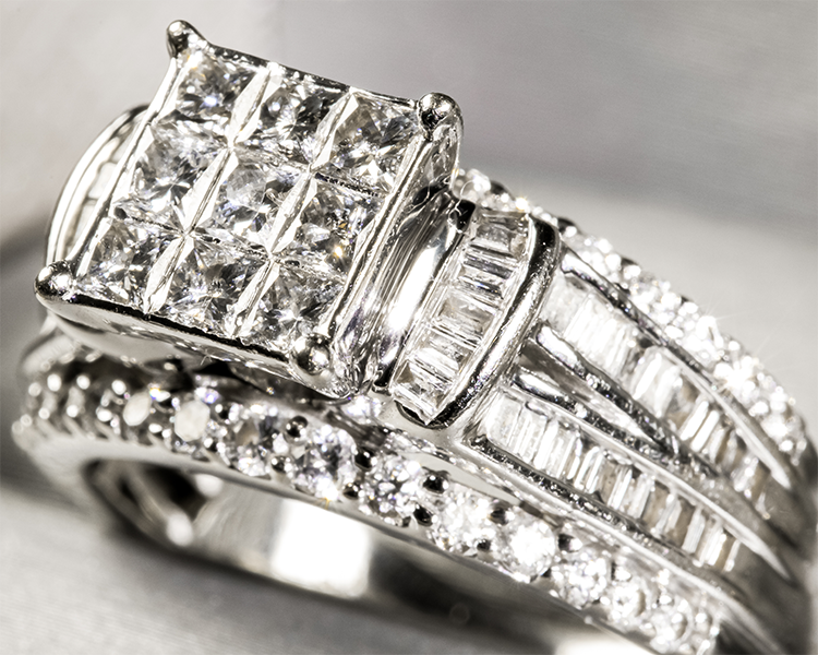 Close Up Side View of Invisible Set Diamond Ring Displayed in Ring Box