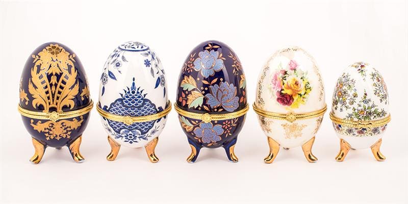 Ceramic Artisanal Jewelry Eggs on Display on White Background