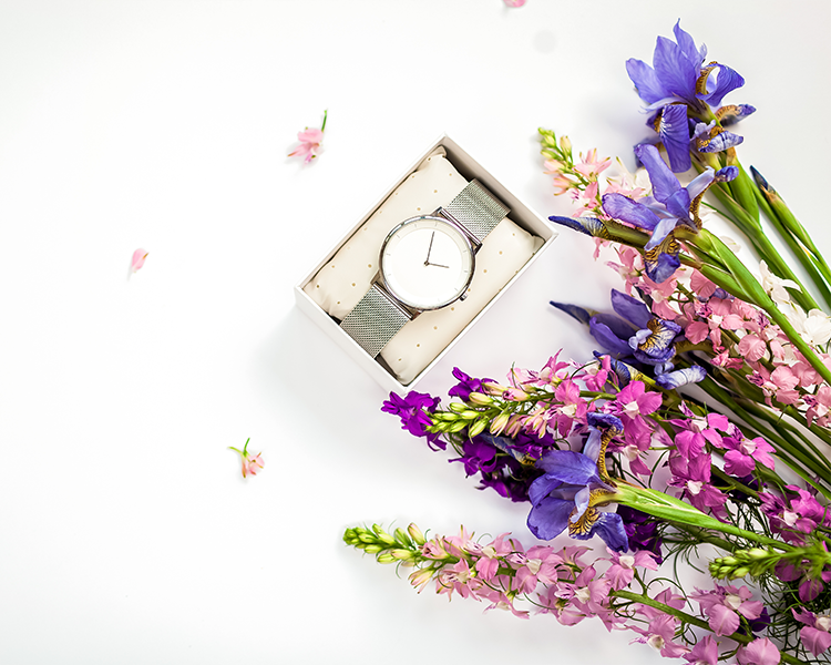 Restored Women's Watch in Box Displayed with Pink and Purple Flower Bouquet