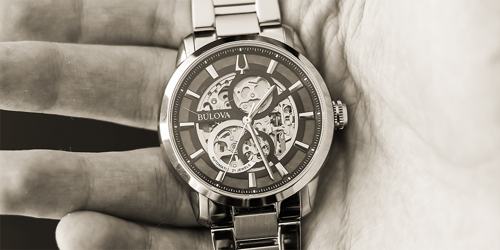 Black and White Close Up of Restored Bulova Watch in Man's Hand