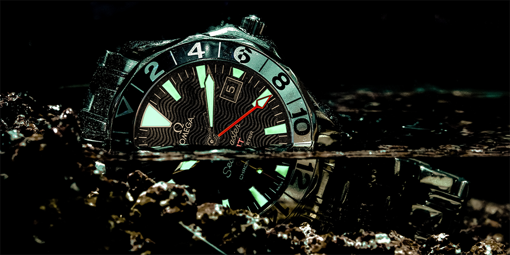 Close Up of Omega Seamaster Chronometer Watch Displayed Halfway in Water