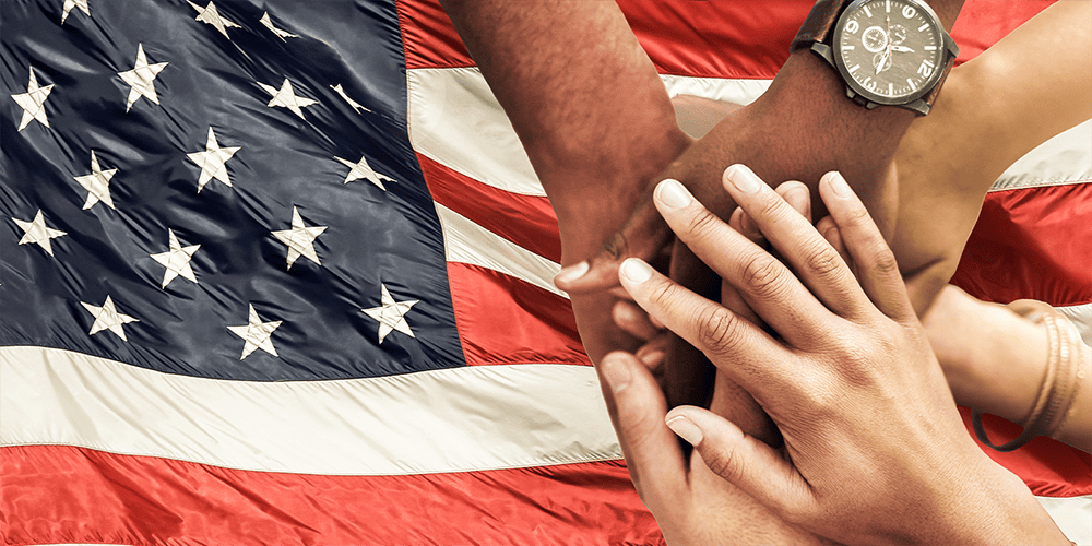 Hands Piling on Top of Each Other with Jewelry and Watches Displayed with USA Flag